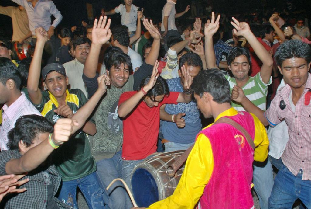 People dancing in the streets of Lahore after Pakistan won the quater finals against West Indies